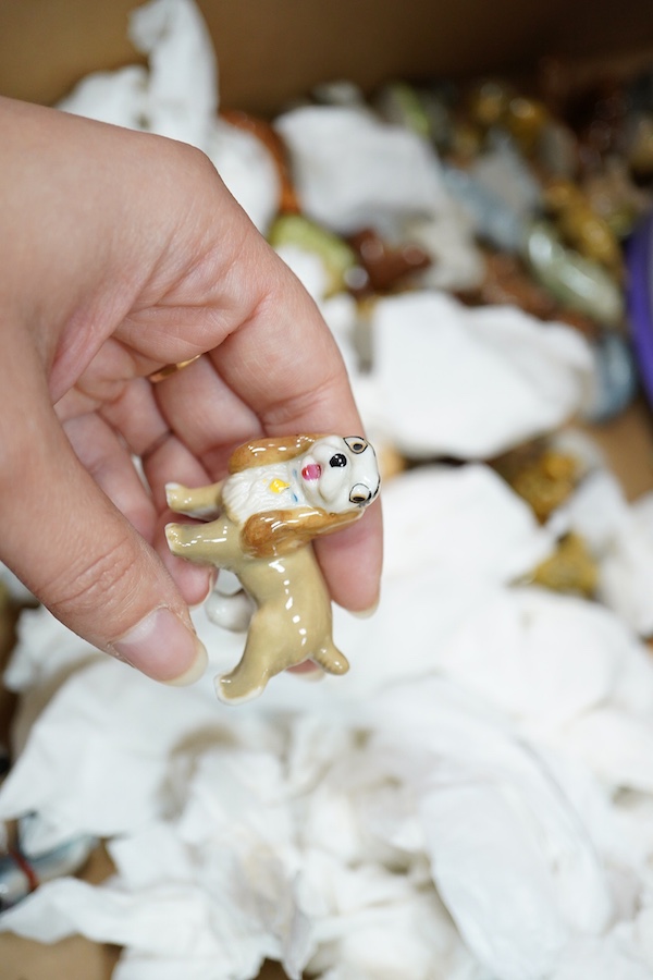 A large collection of Wade Whimsies including Disney Characters and a collection of blown glass animal figures